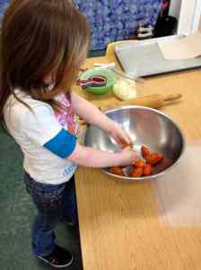 Hadley squeezing tomatoes
