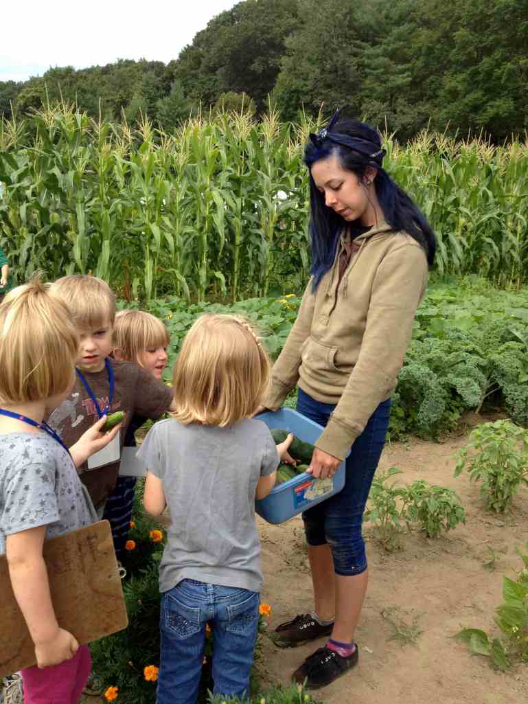 Sharing Cucumbers Teens and Preschoolers
