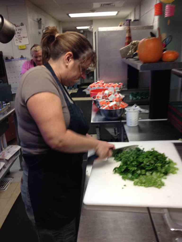 Our kitchen chef, Kim Kinney, using frosted celery in soups.
