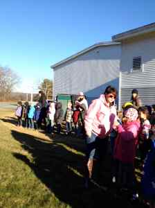 Younger classes watch tilling