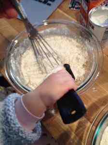 adding dry ingredients to wet