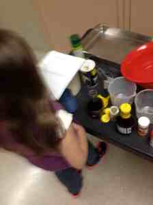 reading recipe lining up ingredients