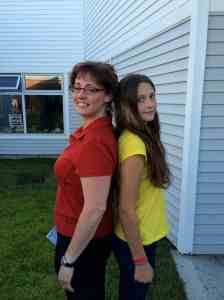 Mom and daughter measuring up